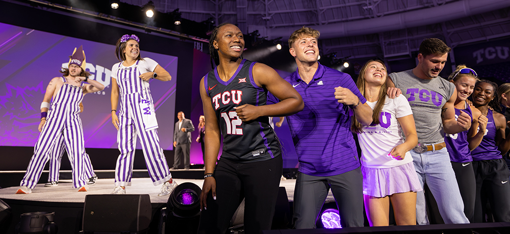 Students on stage celebrating the successful completion of the campaign