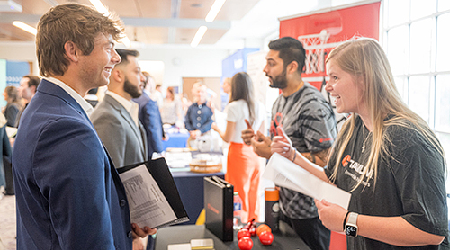 Students talking to employers at a Career Fair