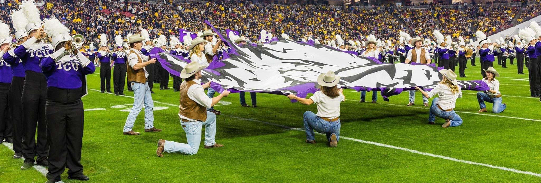Section Image: Rangers with the Frog Flag on the field with the TCU band 