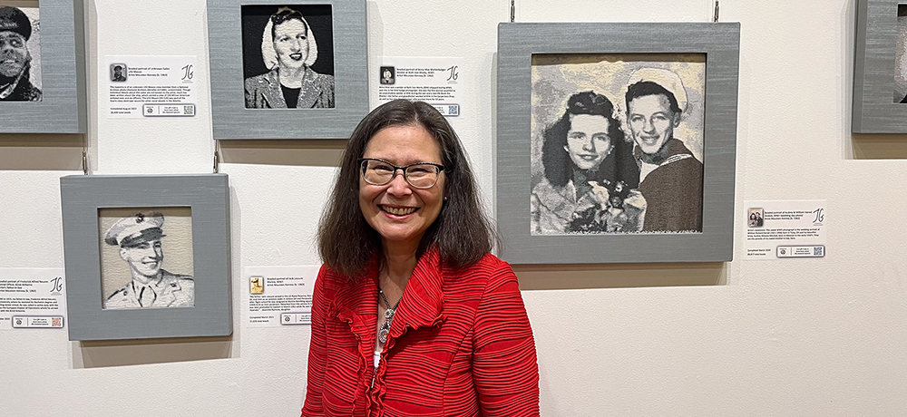 Section Image: Maureen Kenney in front of her bead art exhibit at the Dross Heritage and Culture Center 
