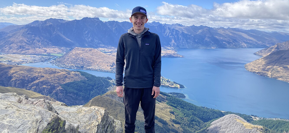 Michael Phillips on top of a ridge looking down on a lake