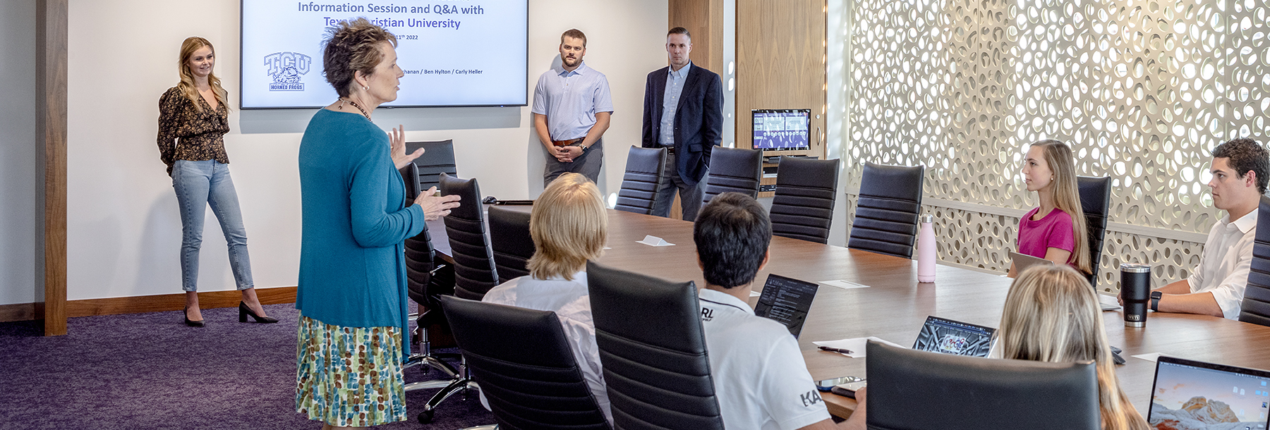Section Image: Students and Dr. Barbara Wood in the Neeley Boardroom 