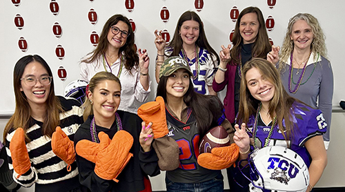 TCU students with helmets and mitts