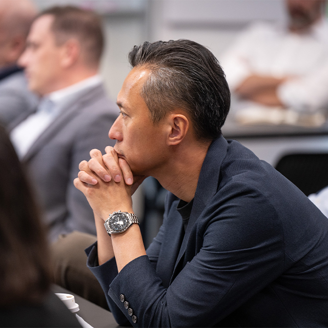 Executive education participant listening in program