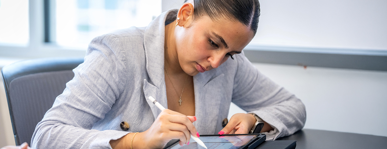 Professional MBA student taking notes